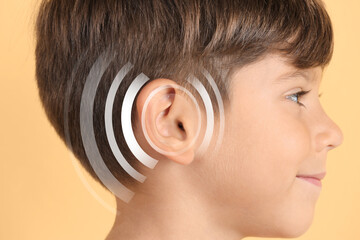 Wall Mural - Hearing loss concept. Little boy and sound waves illustration on yellow background, closeup