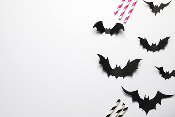 Wall Mural - Flat lay composition with paper bats and straws on white background, space for text. Halloween celebration