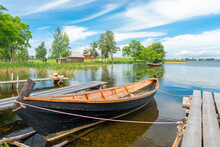 Old Wooden Boat In A Small Picturesque Bay On The Lake