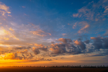 Wall Mural - The dawn sky over the village. A wonderful morning landscape