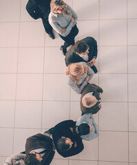 Wall Mural - top view. business leader standing ahead of his colleagues.