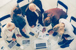 © yurolaitsalbert - top view. group of employees analyzing financial performance .