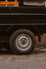 Photo Of The Back Of A Pickup Truck Parked At Traditional Market Showing The Rear Wheels