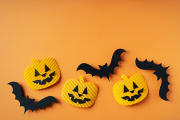 Kids halloween handmade paper pumpkins and bat, creative, craft concept