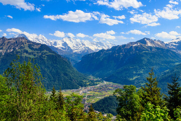 Canvas Print - Breathtaking aerial view of Interlaken and Swiss Alps from Harder Kulm viewpoint, Switzerland