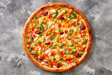 Colorful Pizza With Mozzarella, Sous Vide Chicken, Vegetable Mix On Gray Stone Surface