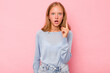 © Asier - Caucasian teen girl isolated on pink background having an idea, inspiration concept.