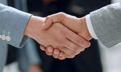 Fototapete - Close up handshaking businessman partner successful concept