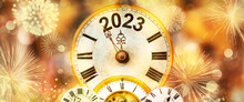 2023 New Year With Fireworks And Clock Counting Down To Midnight With Defocused Golden Background