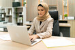 © tai - beautiful business Muslim hijab woman work. serious female islam person think about plan while working at workplace. occupation focus arabic worker thinking and find motivation for working in office