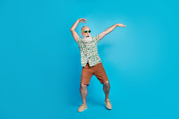 Poster - Full length photo of bearded funny excited granddad wear green stylish sunglass hands up posing crazy carefree sale isolated on blue color background