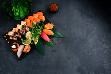 Wall Mural - Set of sushi, maki on stone table. Top view with copy space