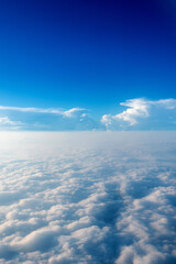 Wall Mural - blue sky and white cloud from airplane window