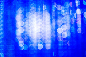 Defocused lights with white and blue bokeh for Christmas background