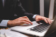 © chokniti - business person hands typing on computer keyboard closeup banner, businessman or student using laptop at home, online learning, internet marketing, working from home, office workplace freelance