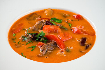 Wall Mural - Asian Tom Yam soup with shrimps, coconut milk, tomatoes, lemongrass, mint and cilantro