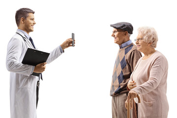 Canvas Print - Young doctor showing a mobile phone to elderly patients