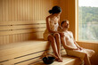 © BGStock72 - Young couple relaxing in the sauna