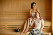 © BGStock72 - Young couple relaxing in the sauna
