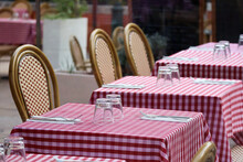 Tables On A Restaurant Terrace With A Typical Red Checkered Tablecloth
