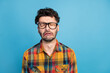 © deagreez - Photo of stressed brunet guy cry wear eyewear plaid shirt isolated on blue color background