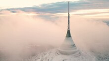 Jested Broadcast Tower With Hotel Built On Forestry Mountain Top Surrounded With Fog Cloud. Modern Building With Spire As Symbol Of Liberec Aerial View