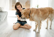 © tan4ikk - Girl with golden retriever dog