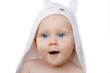 Happy laughing baby wearing white hooded rabbit towel. Portrait of clean dry child. Bathing and washing of little kids. Children hygiene. Textile for infants.