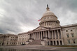 © Silverman Media  - The east side of the United States Capitol Building in Washington, D.C. seen on a winter afternoon. The sky is filled with grey clouds while the plaza is devoid of people. Low angle wide shot.