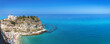 Tropea beach along the Tyrrhenian Sea Coast of Gods (Costa degli Dei). Sanctuary of Santa Maria dell'Isola is the symbol of Tropea, Calabria, southern Italy.