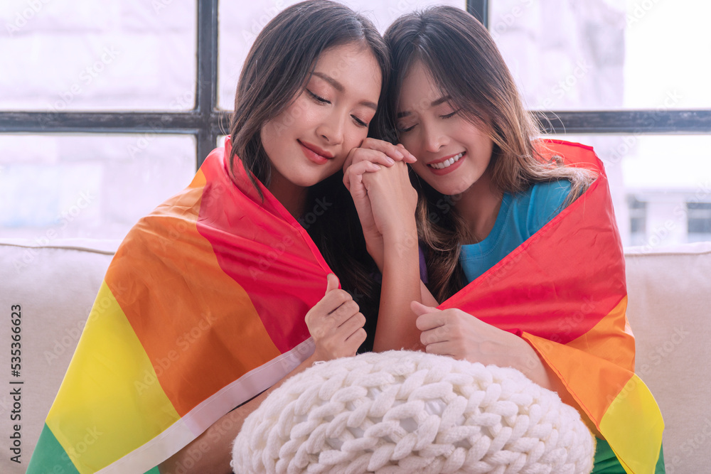 Romantic asian couple woman hugging each other together with rainbow ...