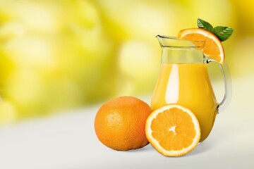 Canvas Print - Lemon slush in tall jug with fruit and crushed ice on the desk.