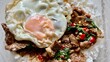 Stir fried beef basil with rice and fried egg