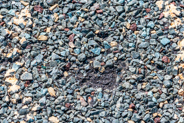 Macro of hail damage on a shingle residential roof circled with a chalk outline during a home inspection.