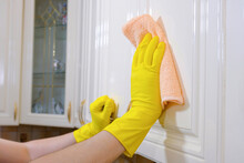 Person Wearing Gloves Cleaning House Parts