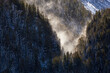 Snow blowing into a mountain ravine