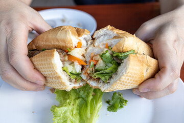 Wall Mural - Famous Vietnamese food - Banh Mi Sandwich Bread at Restaurant