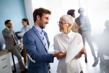 Wall Mural - Group of multiethnic successful business people working and communicating at the office