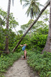 © FEDEMARINIC - Caucasian man in sportswear doing yoga poses in nature. Outdoor yoga