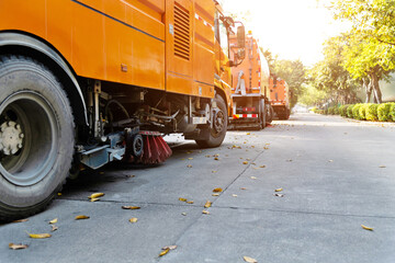 Street sweepers are cleaning city street