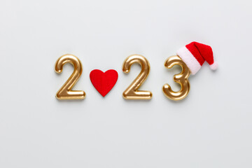 Happy New Year 2023 poster. Christmas background with gold 2023 numbers.