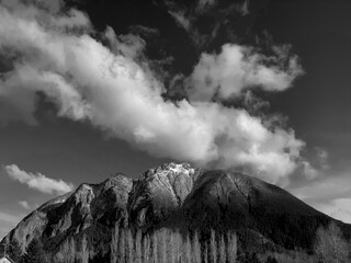 Wall Mural - Grayscale shot of Mount Si from North Bend, Washington under a bright cloudy sky