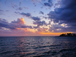 Wall Mural - Scenic sunset in the Rab island, in Croatia with yellow cloudy sky over the ocean