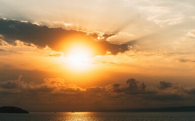 Poster - Cinematic sunset photo in Marseille, France. Boat sailing, colorful sky, landscape, reborn, hopeful