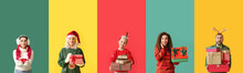 Different Happy People With Christmas Gifts On Color Background