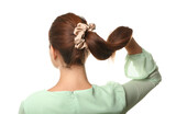 Fototapeta  - Woman with ponytail and silk scrunchy on white background