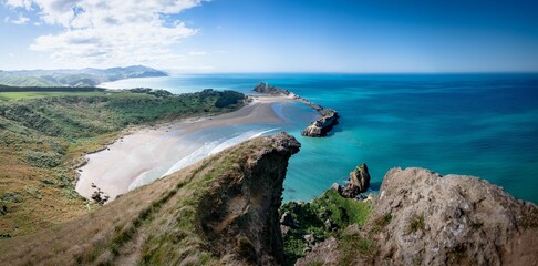 Wall Mural - Beautiful view of turquoise water and rocky shoreline. Castlepoint, Wairarapa, New Zealand.