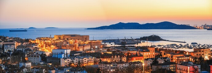 Aerial view of a sunset sky over the coastal city of Qingdao, Shandong Province, China