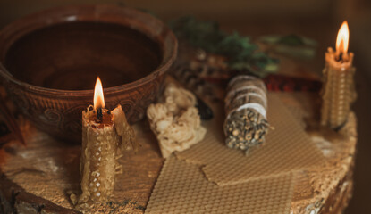 Candle burns on the altar, candles magic, clean aura and negative energy, wicca concept