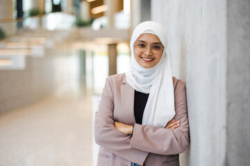 Poster - Portrait of a confident muslim businesswoman in an office building
